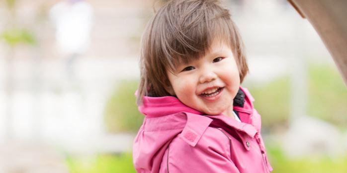 toddler smiling outdoors